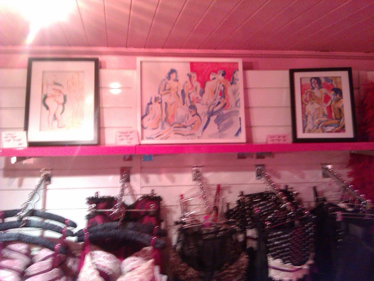3 of Mike Flight's paintings are on the top shelf